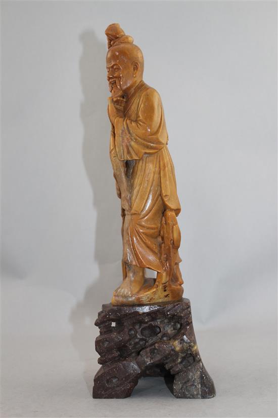 A Chinese soapstone figure of a fisherman, early 20th century, 36cm.